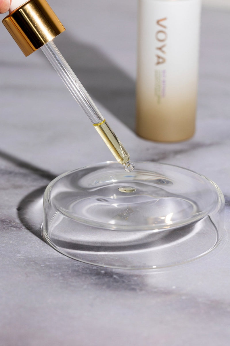 voya bio retinol organic face serum oil dropping from a pipette