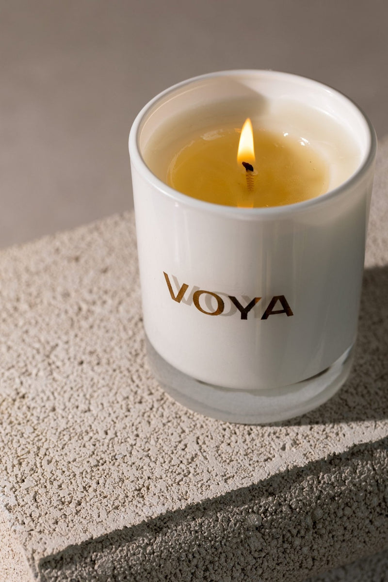 VOYA Skincare USA Eucalyptus, Rosemary, and Lime Luxury Essential Oil Candle in use.