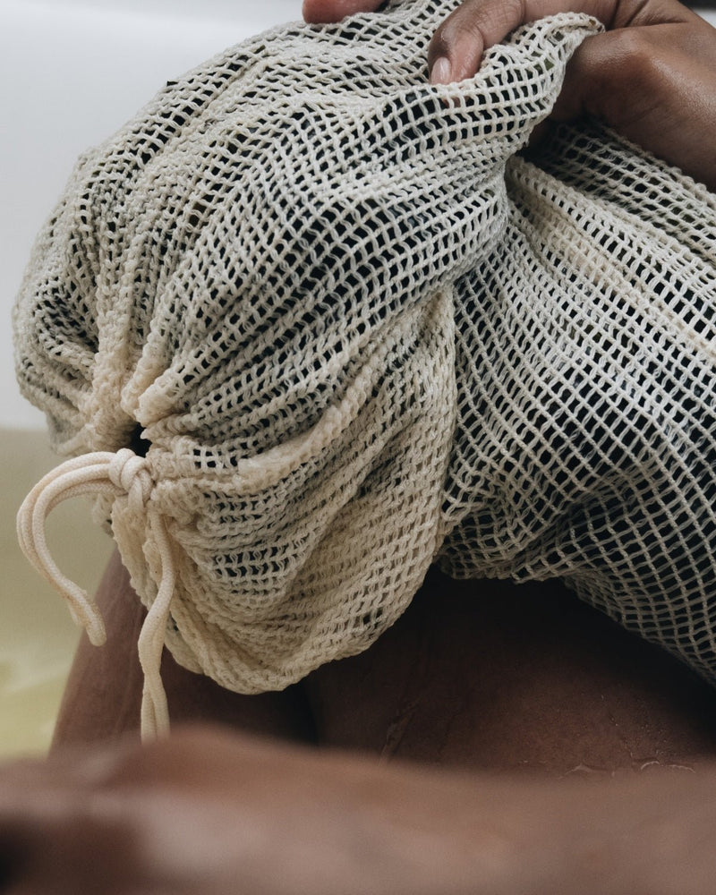 Close up of VOYA Skincare USA Organic Mesh Bag and Lazy Days at Home Seaweed Bath