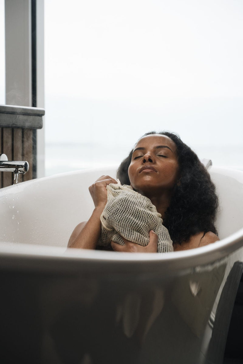 VOYA Skincare USA Organic Mesh Bag and Lazy Days at Home Seaweed Bath in use